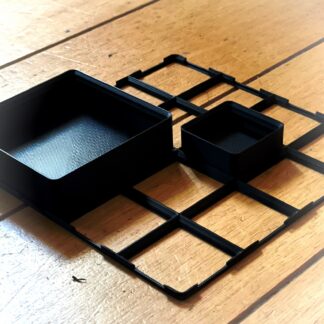Gridfinity 1x1 en 2x2 bakken op open baseplate prototype